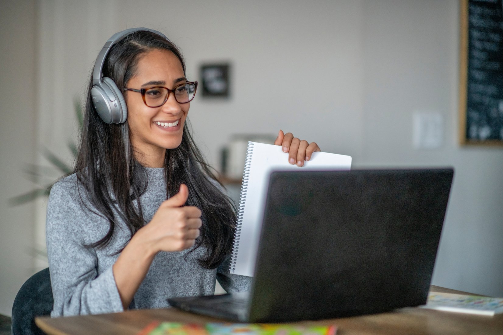 Teacher teaches her class through online learning.